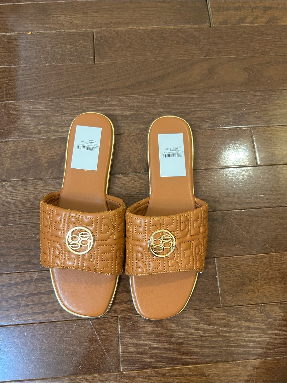 Quilted Cognac Slide Sandals with Gold Emblem